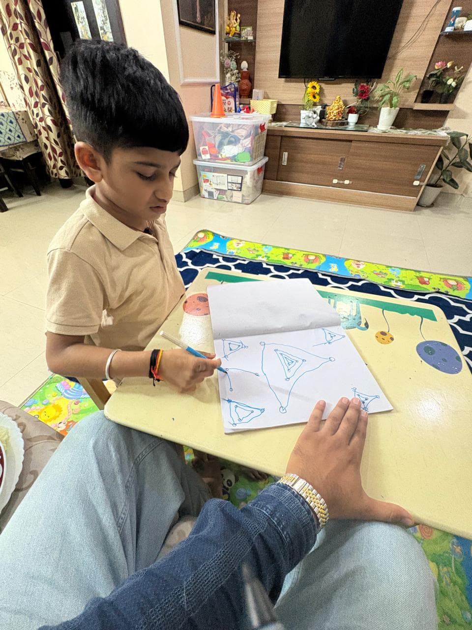 Child practising drawing and writing during therapy