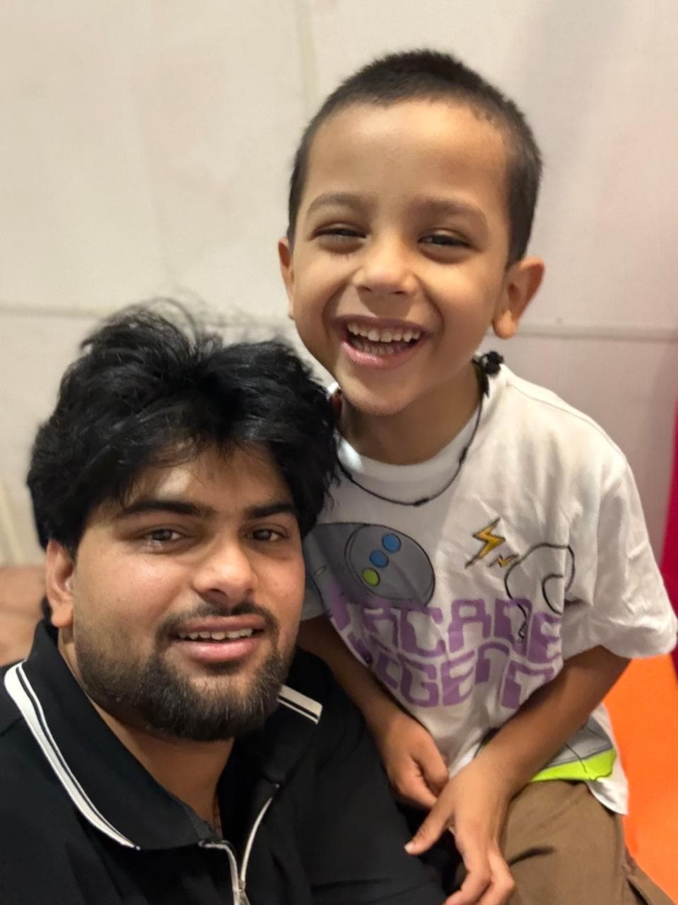 A therapist and a laughing child at Positive Zone